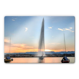 Glasbild Wasserfontäne im Genfer Sonnenuntergang 