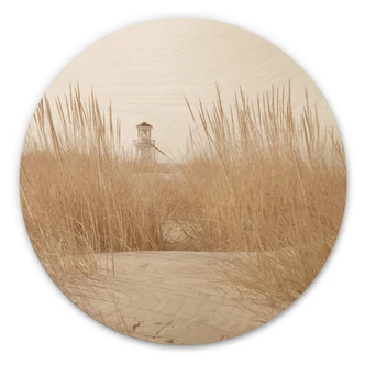 Tableau sur bois rond Phare dans l'herbe des dunes 