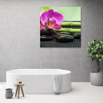 Leinwandbild, Orchidee auf schwarzen Steinen 