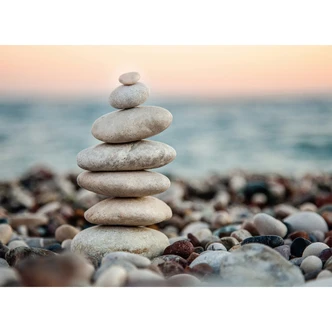 non-woven tapet Stone Beach fototapet med foto af havet strand fototapet Designwalls i grå og blå  