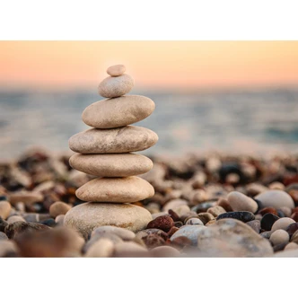 Vævet tapet Designwalls i grå og blå Vævet tapet Stone Beach hav strand 