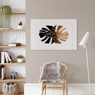 Glasbild Kubistika - Schwarz-goldene Monstera Blätter 