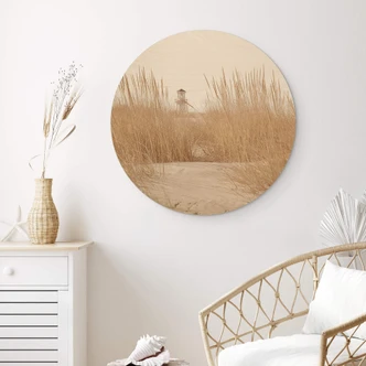 Tableau sur bois rond Phare dans l'herbe des dunes 