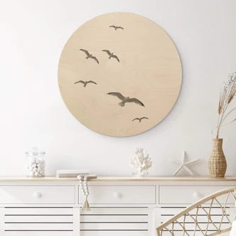 Tableau sur bois rond Mouettes dans le ciel 