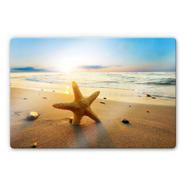 Glasbild Seestern im Sand 