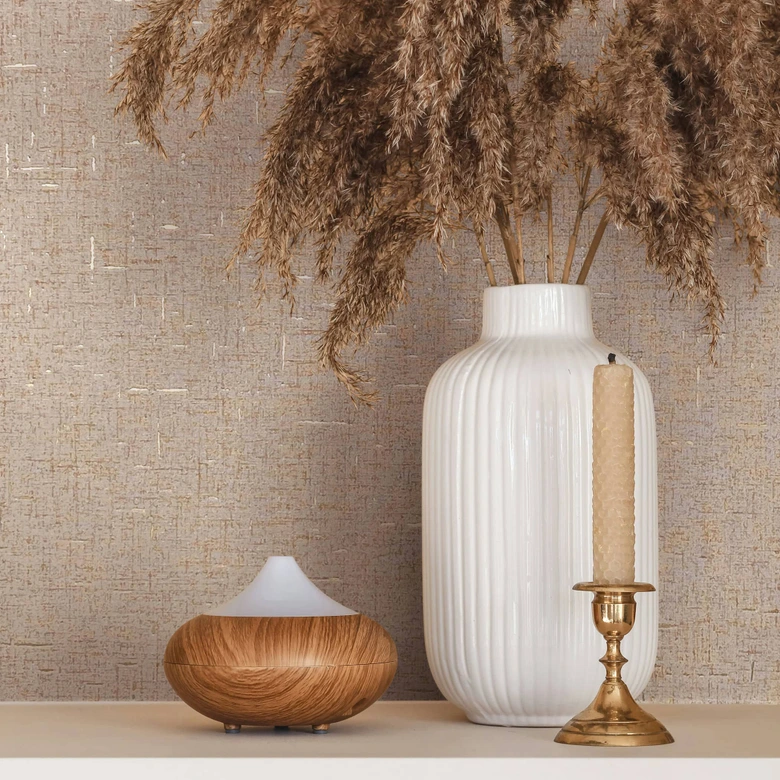 Non-woven wallpaper in a slightly shiny texture, beige plain 