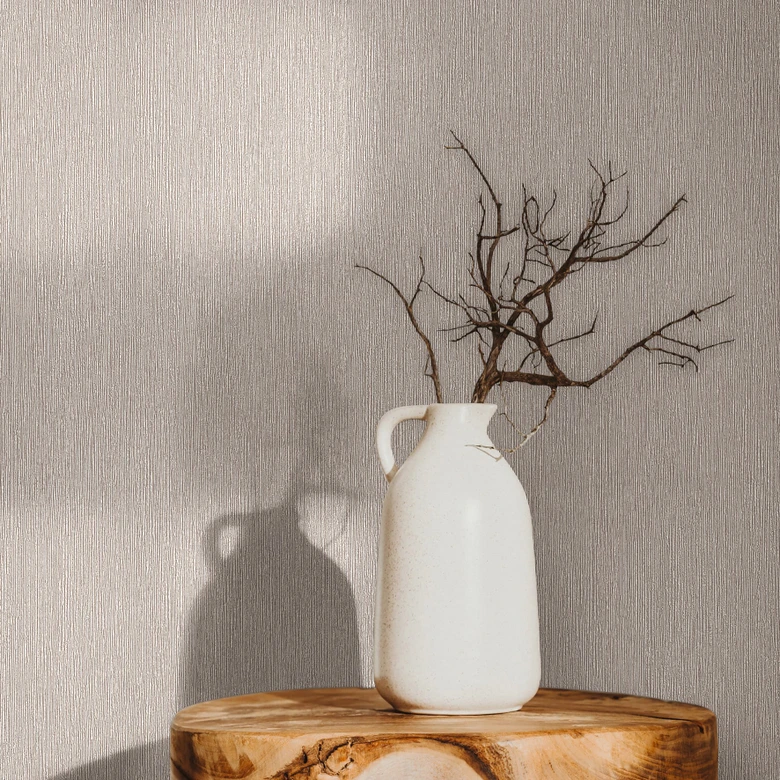 Tapeta z włókniny o teksturowanej powierzchni w kolorze szarym, brązowym gładkim 