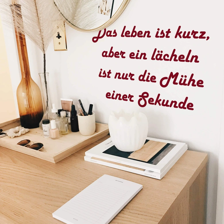 Wandtattoo Das Leben ist kurz, aber ein Lächeln... 