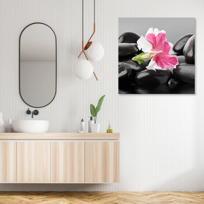 Leinwandbild, Rosa Blume auf Zen Stones 
