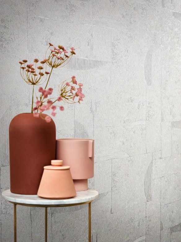 Papel pintado no tejido con aspecto de escayola en gráfico gris teja 