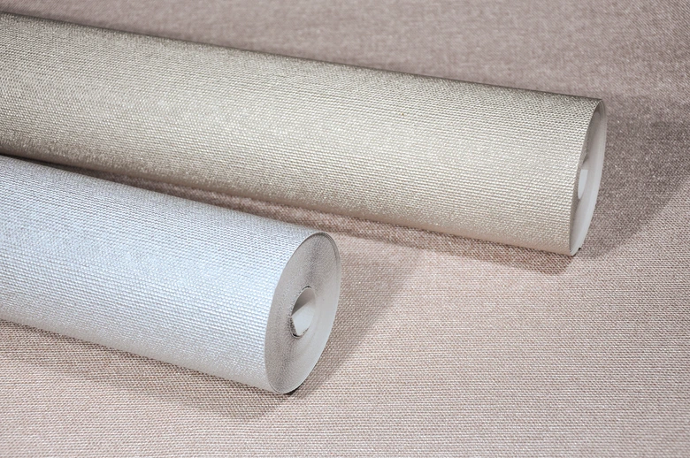 Non-woven wallpaper with a light textured look in solid copper structure  